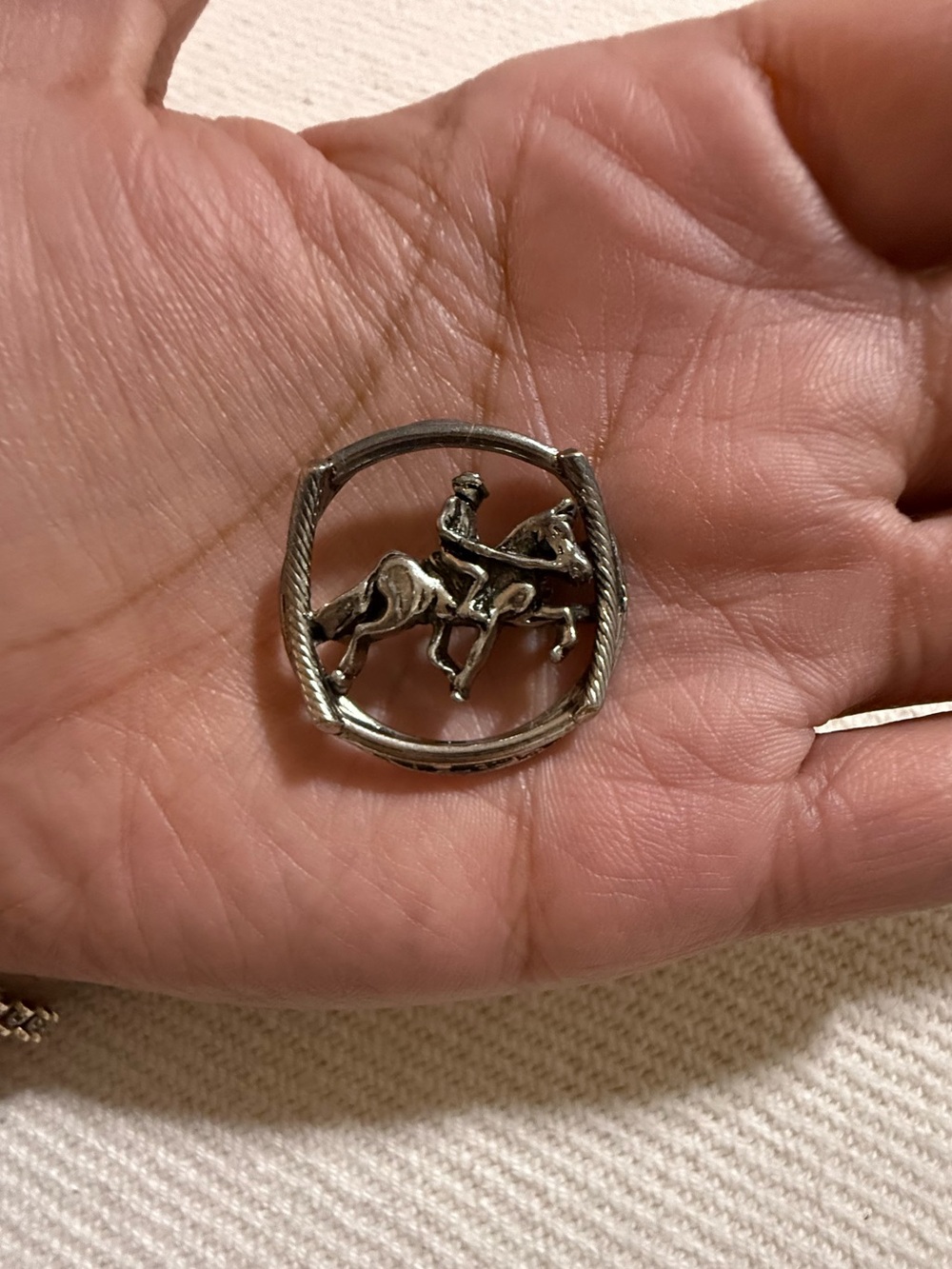 Vintage equestrian horse and rider open circle brooch.
